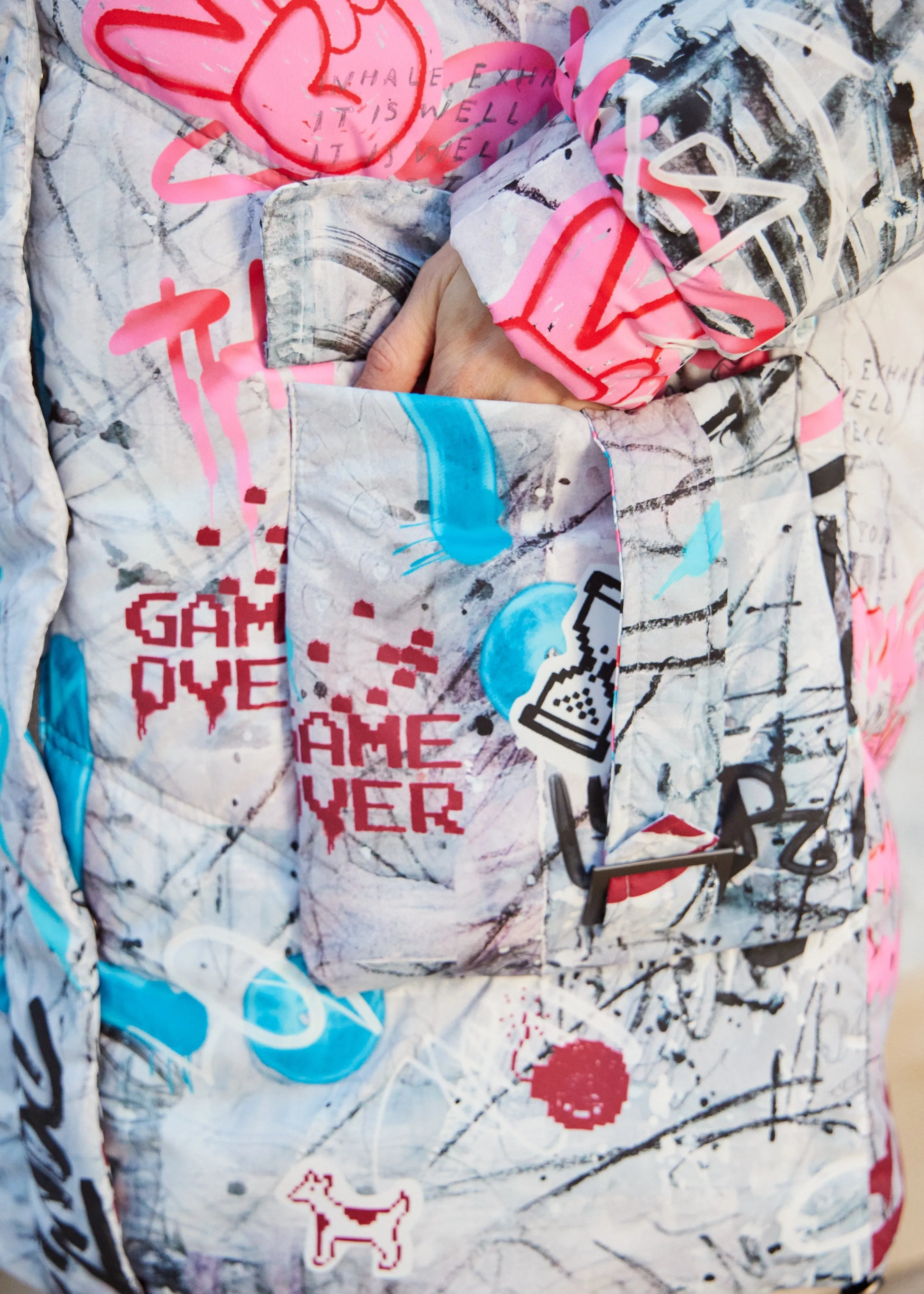 Graffity Printed Puffer Jacket for Women – Artistic & Cozy Design